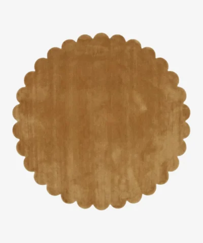 Top down view of the circular Camel Dawn golden tan hand tufted wool rug on a white background showing the scalloped border.