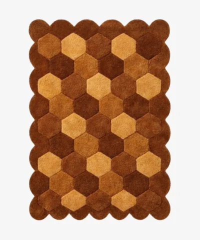 High angle view of the Cocoa Harlequin rug featuring a classic diamond checkerboard pattern in warm brown, tan, and cream wool tones, framed by a scalloped border.
