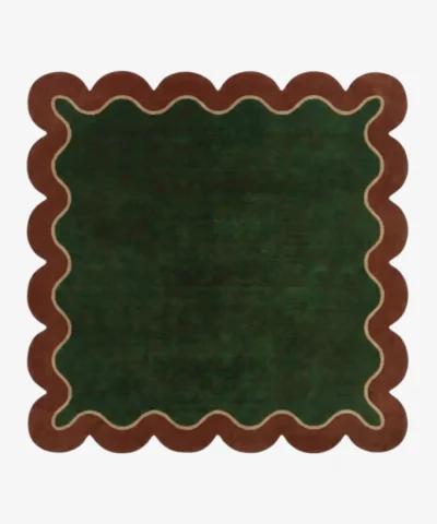 Top down view of the Forest Frame Square rug featuring a lush deep green central field framed by a wavy cream line and a rust-colored scalloped border.
