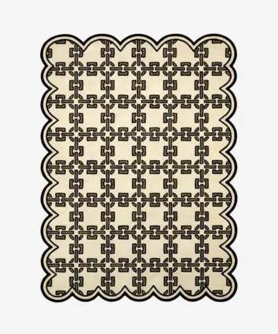 Top down view of the Heritage Lattice rug featuring a sophisticated cream wool background with an intricate dark brown interlocking geometric chain pattern and custom scalloped edges.