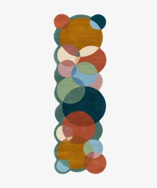 Top down view of the Ochre Orbit runner rug on a white background, featuring a modern geometric pattern of interlocking colorful circles with custom shaped scalloped edges.