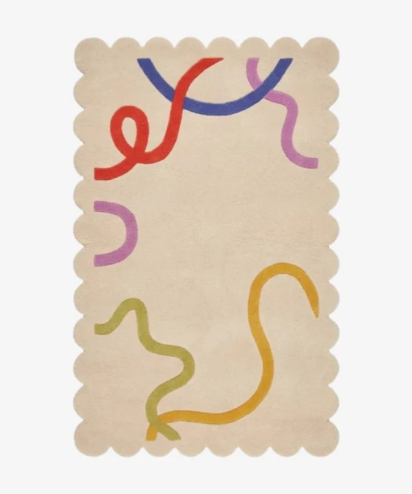 Top down flat lay of the Pastel Doodle rug featuring a soft cream background with playful abstract lines in red blue purple and yellow.