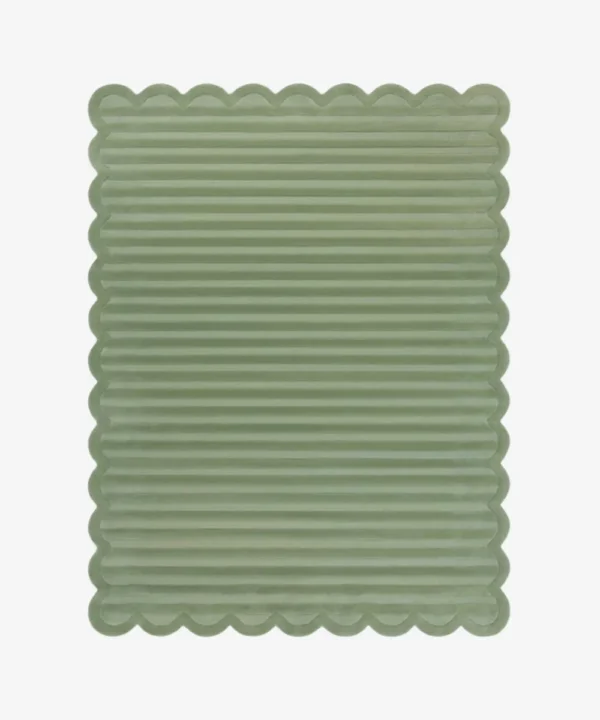 Top down view of the Sage Rhythm rug featuring a solid sage green color with horizontal carved textures and decorative scalloped edges.