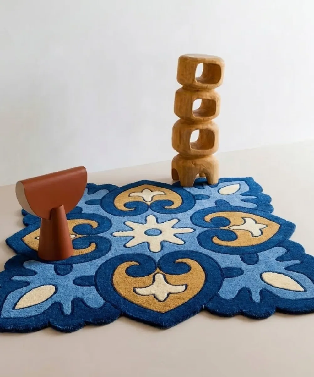 Decorative square wool rug styled with wooden art, serving as a link to browse Square and Accent shapes.