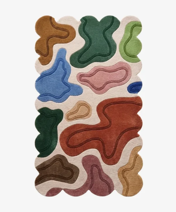Top down view of the Terra Pebble rug featuring a cream background with distinct organic abstract shapes in terracotta blue green and pink.