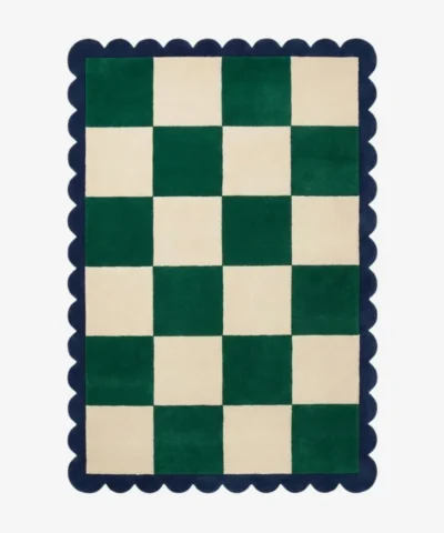 Top down view of the Arcet Offset rug featuring a playful checkered pattern with shifted blocks and curved "arc" details in high-quality wool, finished with custom scalloped edges.
