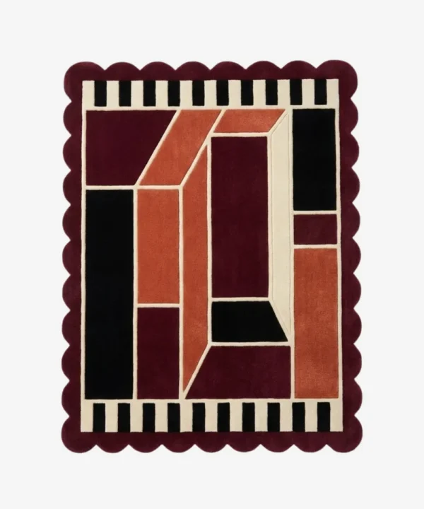Top down view of the Burnt Frame rug featuring a neutral wool center framed by a rich burnt orange and brown border, finished with custom scalloped edges.