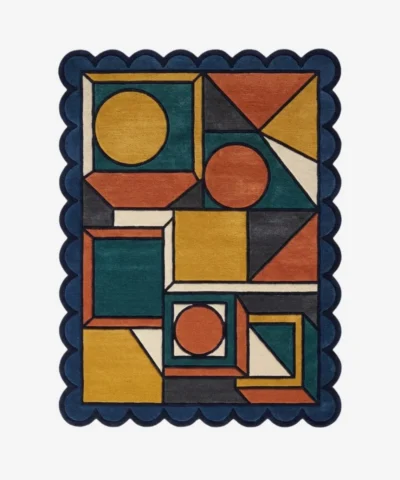 Top down view of the Harvest Loom rug featuring a complex geometric pattern of circles and squares in warm harvest tones of rust, mustard, and teal, finished with custom scalloped edges.