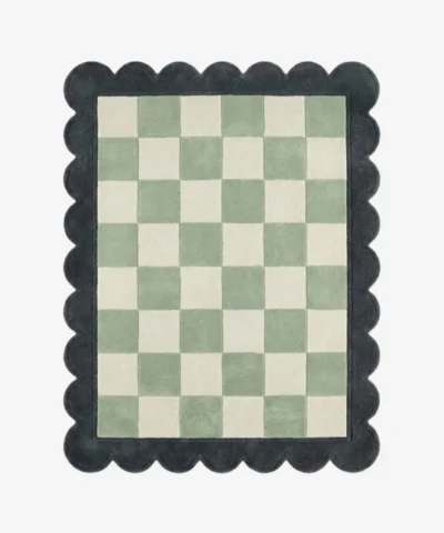 Top down view of the Lune Mist rug featuring a serene grey and off-white wool background with abstract crescent-inspired curves, finished with custom scalloped edges.