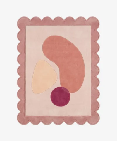 Top down view of the Rose Veil rug featuring a romantic, ethereal design with layers of soft rose pink and sheer white accents, finished with custom scalloped edges.