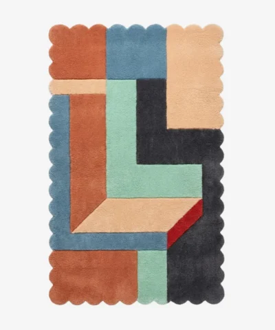 Top down view of the Soft Switch rug featuring a plush wool background with a crisp geometric grid pattern and custom scalloped edges, offering a modern and structured aesthetic.