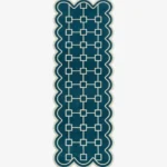 Top down view of the hand-tufted Terenza Coil Runner Rug featuring a rich teal background, a cream geometric square chain pattern, and distinctive scalloped edges.