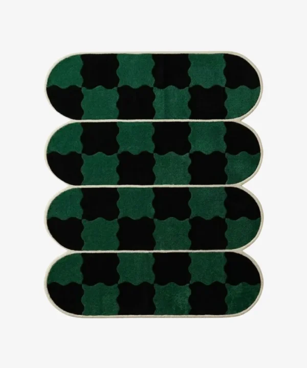 Top-down view of the Verdure Drift rug, featuring four horizontally stacked, pill-shaped segments defined by crisp cream borders, filled with a distorted, wavy checkerboard pattern in emerald green and black.
