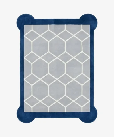 Top-down, flat view of the rectangular Azure Lattice Scallop Rug on a white background. The design showcases a light grey center with a white honeycomb lattice pattern, framed by a thick dark blue border with unique rounded corner details.