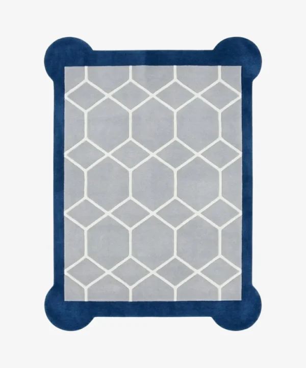 Top-down, flat view of the rectangular Azure Lattice Scallop Rug on a white background. The design showcases a light grey center with a white honeycomb lattice pattern, framed by a thick dark blue border with unique rounded corner details.