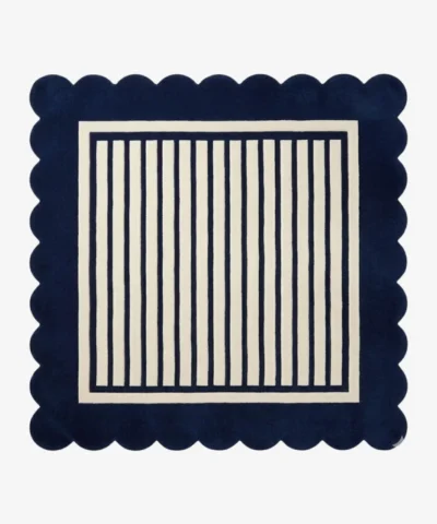 A flat, top-down view of the Coastal Manor Square Rug on a clean white background. The tufted square rug features a classic navy blue and cream vertical striped center, beautifully framed by a thick navy blue scalloped border.