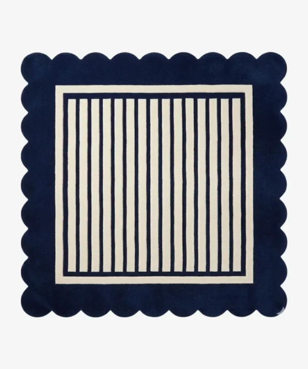 A flat, top-down view of the Coastal Manor Square Rug on a clean white background. The tufted square rug features a classic navy blue and cream vertical striped center, beautifully framed by a thick navy blue scalloped border.