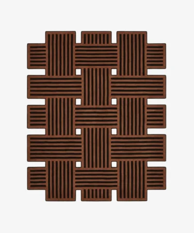 Custom-shaped Basket Weave rug isolated on a white background, featuring a geometric intertwined pattern of solid brown and black lines with open cut-outs.