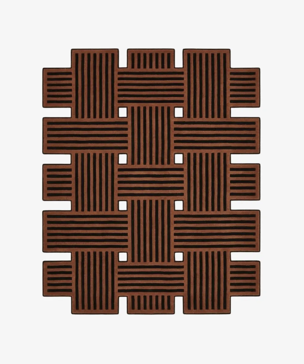 Custom-shaped Basket Weave rug isolated on a white background, featuring a geometric intertwined pattern of solid brown and black lines with open cut-outs.
