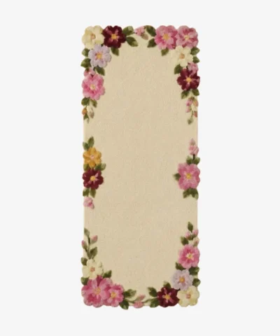 Top-down view of the off-white Blossom Border Runner Rug featuring a decorative edge of hand-tufted pink, burgundy, and yellow flowers with green leaves.
