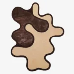 Top-down view of the Contour Flow rug isolated on a white background, featuring a fluid, abstract silhouette with interlocking organic shapes in dark brown and off-white.