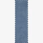 Top-down flat view of a solid dusty blue runner rug showcasing its continuous scalloped edge design against a clean white background.