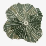 Top-down view of the Green Botanical Irregular rug isolated on a white background, featuring an organic, flowing leaf-like silhouette in solid green and off-white tones.