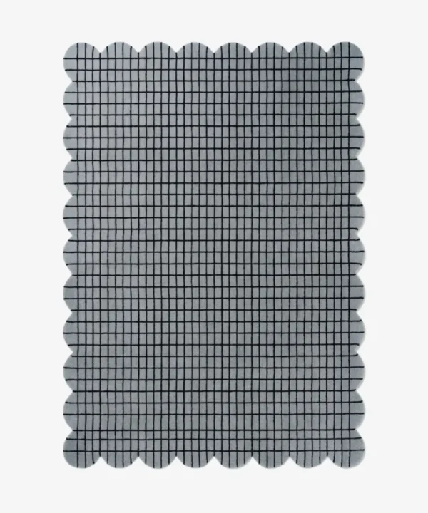 Top-down view of the rectangular Gridline Scalloped Rug featuring a textured gray base with a black check grid pattern.