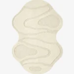 Top-down view of the Ivory Mirage Irregular rug isolated on a white background, featuring a fluid, hourglass-like silhouette with carved organic wave patterns in a solid off-white tone.