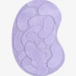 Top-down view of the Lilac Flow Irregular rug isolated on a white background, featuring raised organic pebble shapes in a solid light purple tone.