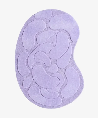 Top-down view of the Lilac Flow Irregular rug isolated on a white background, featuring raised organic pebble shapes in a solid light purple tone.