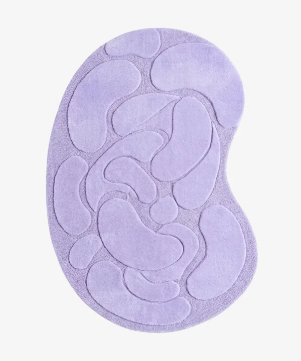 Top-down view of the Lilac Flow Irregular rug isolated on a white background, featuring raised organic pebble shapes in a solid light purple tone.