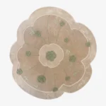 Top-down view of the Meadow Dune rug isolated on a white background, featuring an off-white base with green rose and radiating stem motifs in a scalloped floral shape.