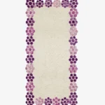 Top-down view of the off-white Petal Dot Runner Rug featuring a scalloped border made of purple and pink tufted circles.