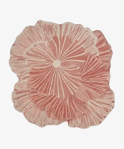 Top-down view of the Rose Reverie rug, an abstract, multi-layered pink and cream floral design, isolated on a white background.