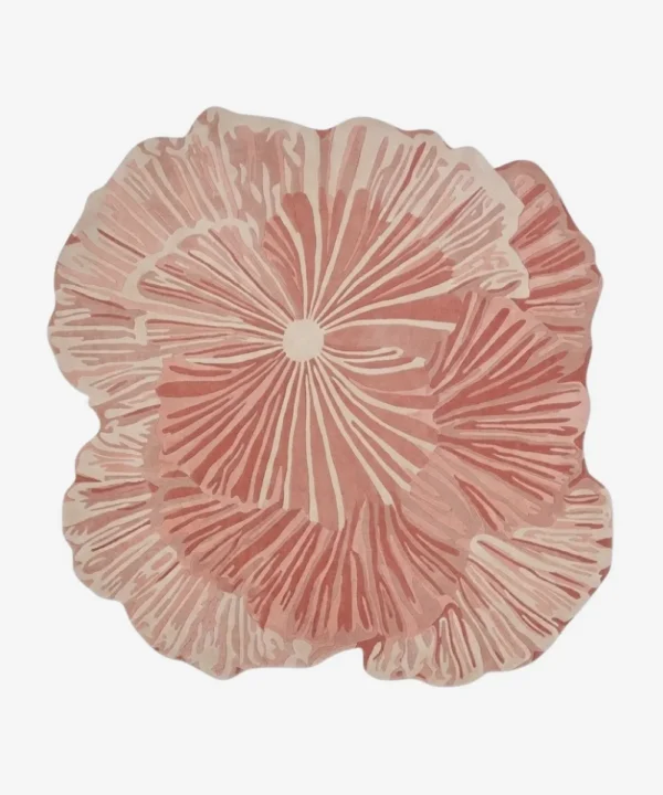 Top-down view of the Rose Reverie rug, an abstract, multi-layered pink and cream floral design, isolated on a white background.