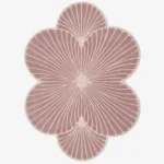 Top-down view of the Rose Ripple rug isolated on a white background, featuring a floral shape with pink and off-white solid color blocks.