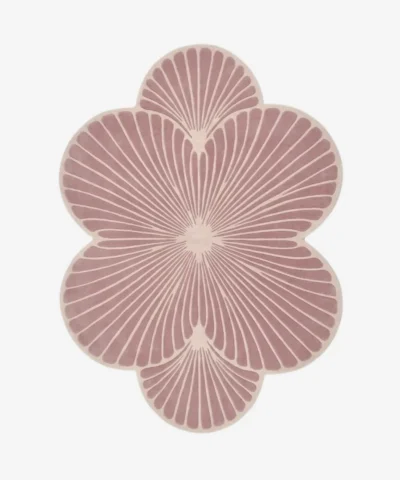 Top-down view of the Rose Ripple rug isolated on a white background, featuring a floral shape with pink and off-white solid color blocks.