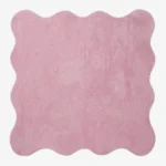A flat, top-down view of the Roselle Rug isolated on a clean white background. The solid rose pink rug features a playful continuous scalloped border and a decorative carved wavy inner line that elegantly mirrors the outer edge, showcasing its plush hand-tufted texture.