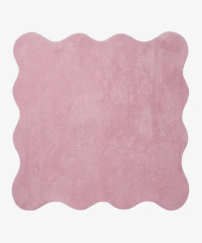 A flat, top-down view of the Roselle Rug isolated on a clean white background. The solid rose pink rug features a playful continuous scalloped border and a decorative carved wavy inner line that elegantly mirrors the outer edge, showcasing its plush hand-tufted texture.