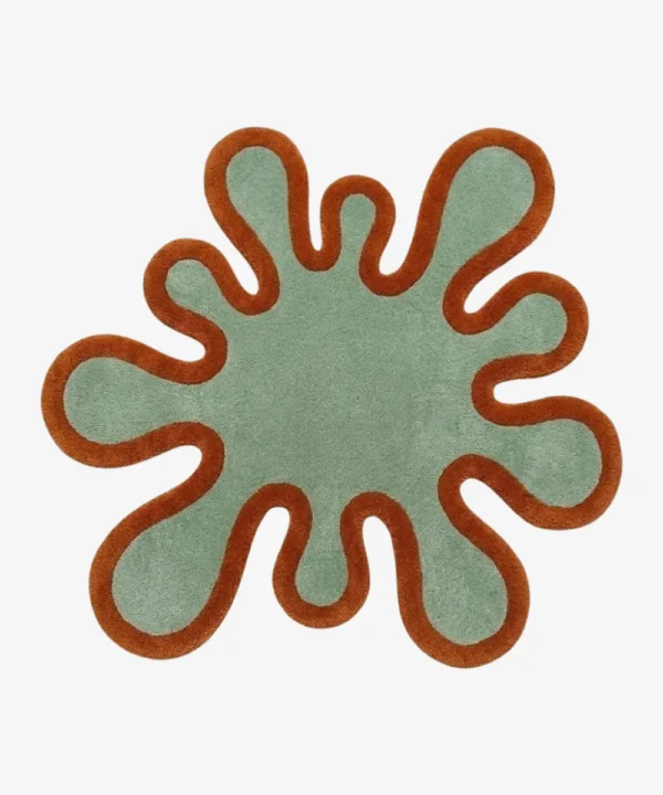 Full top-down view of the Sage Orbit rug isolated on a white background, featuring a flat splash-shaped silhouette in solid sage green with a thick terracotta orange border.