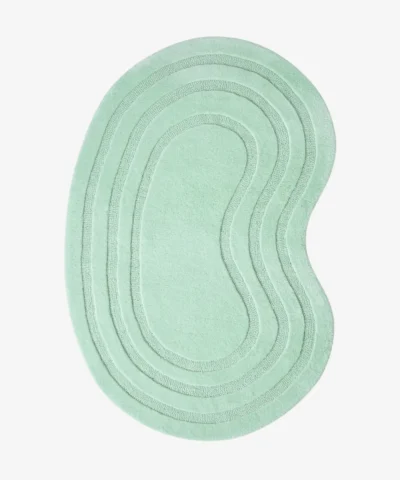 Top-down view of the Sage Ripple Irregular rug isolated on a white background, featuring a kidney-shaped organic silhouette with concentric carved lines in a solid sage green color.