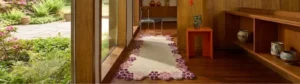 Off-white runner rug featuring a unique scalloped edge design with multi-colored pink accents, placed in a modern corridor.