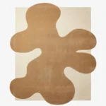 Top-down view of the Sienna Crest rug, featuring a rectangular off-white base overlaid with a large, abstract, organic sienna brown shape.