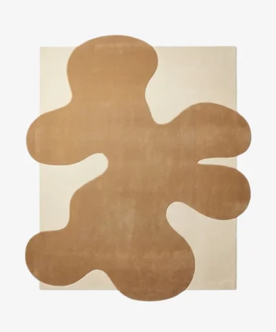Top-down view of the Sienna Crest rug, featuring a rectangular off-white base overlaid with a large, abstract, organic sienna brown shape.