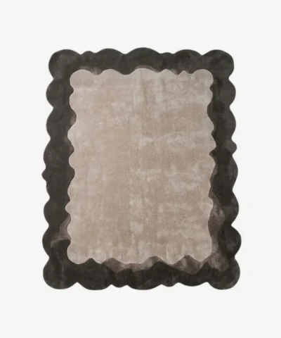 Top-down view of the Smokewood Mist rug isolated on a white background, featuring a textured off-white center framed by a dark gray wavy scalloped border.