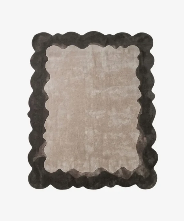 Top-down view of the Smokewood Mist rug isolated on a white background, featuring a textured off-white center framed by a dark gray wavy scalloped border.