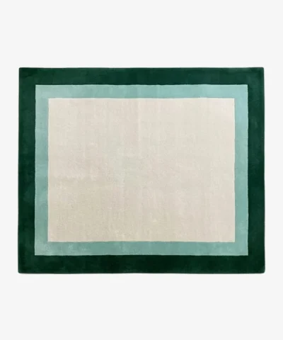 Full top-down product isolated shot of the cream, light teal, and dark green Avelis border rug.