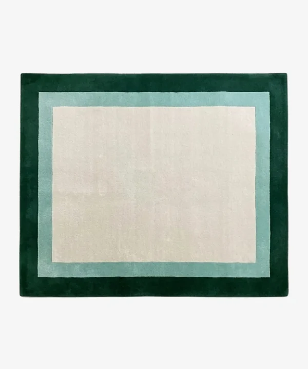 Full top-down product isolated shot of the cream, light teal, and dark green Avelis border rug.