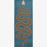An overhead studio shot of the rectangular Azure Serpent Runner rug featuring a winding Greek key patterned snake on a vibrant teal background.